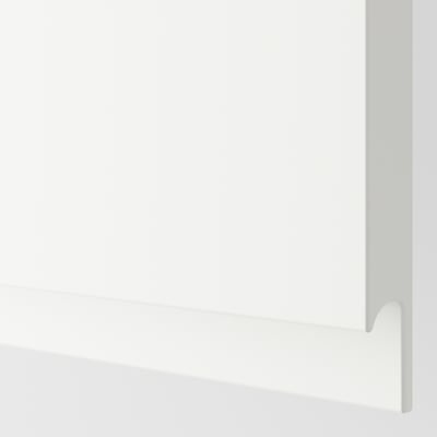 Crisp, white corner of modern kitchen cabinet. Sleek, handles-less design, reflecting minimalist style.