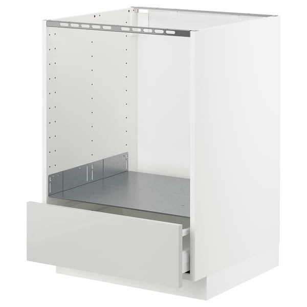 A white METOD kitchen cabinet with a metallic drawer and shelf.