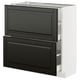 Its an a white ikea METOD kitchen cabinet with black bodbyn drawers and doors with beveled edges.