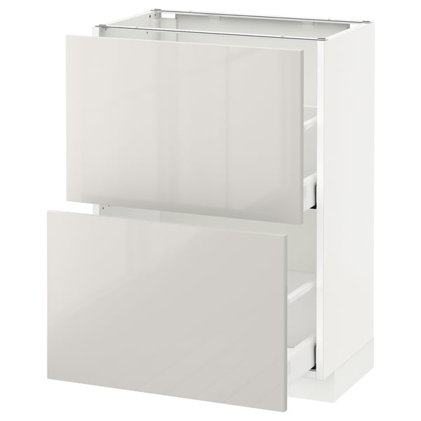 A white METOD kitchen cabinet with smooth surfaces and multiple compartments. It a modern, glossy design with a sturdy structure.