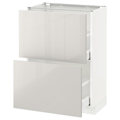 A white METOD kitchen cabinet with smooth surfaces and multiple compartments. It a modern, glossy design with a sturdy structure.