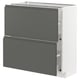 A modern kitchen cabinet unit in white and dark grey with integrated handles. It two drawers and a cabinet with soft-close drawers.
