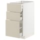 A beige METOD kitchen cabinet with three drawers. The drawers have a smooth, clean look and are partially pulled out.