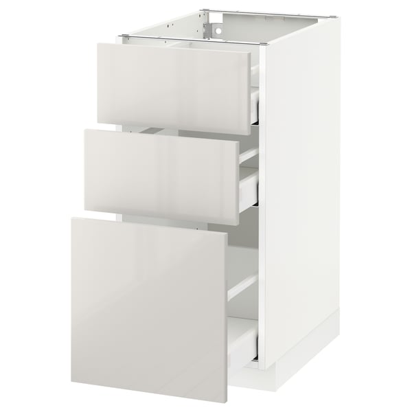 White ikea METOD kitchen cabinet with glossy drawers.