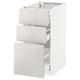 White ikea METOD kitchen cabinet with glossy drawers.