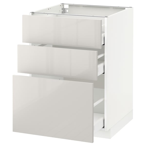 Modern white METOD kitchen cabinet with 3 glossy drawers.