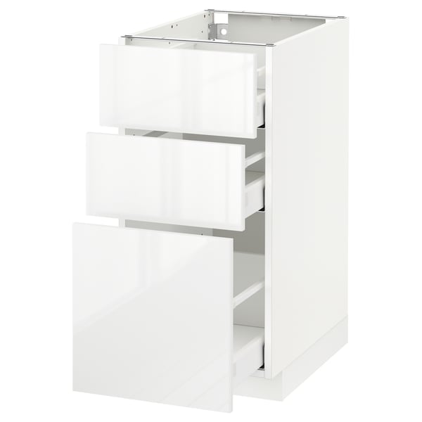 High gloss white kitchen cabinet with three open drawers, sleek modern design.