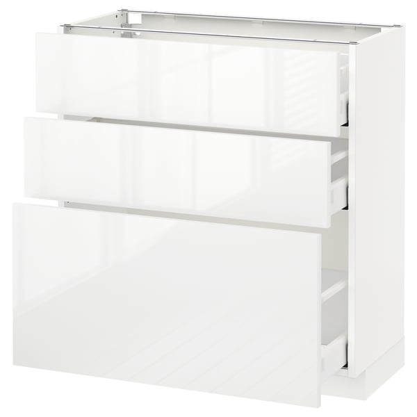 This image shows an ikea METOD kitchen cabinet in white with three drawers and a glass top shelf.