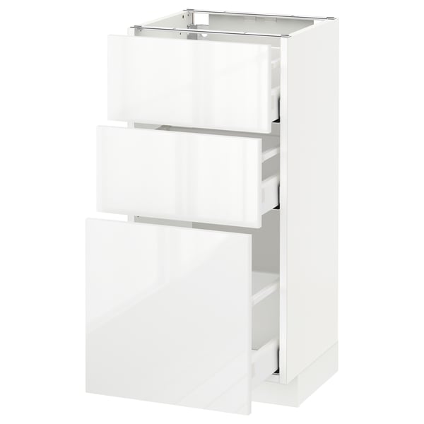METOD white high-gloss kitchen cabinet with multiple drawers.