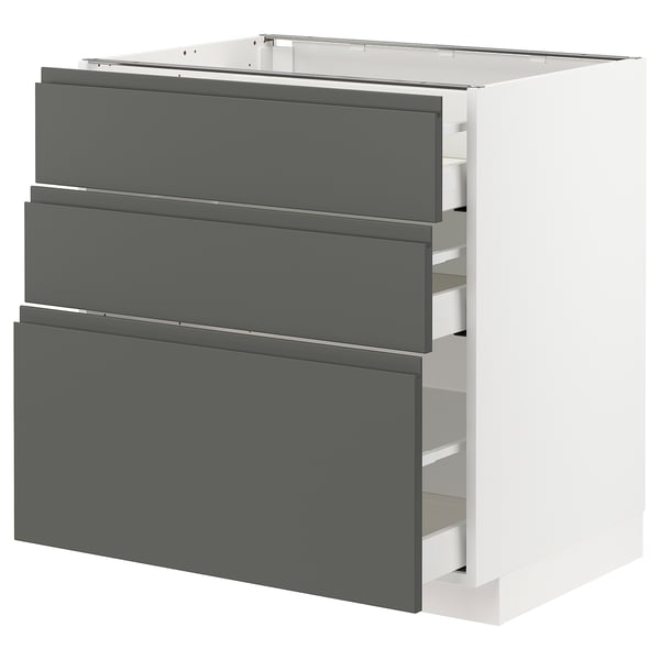 Modern white kitchen cabinet with 3 grey drawers, sleek and minimalist design.