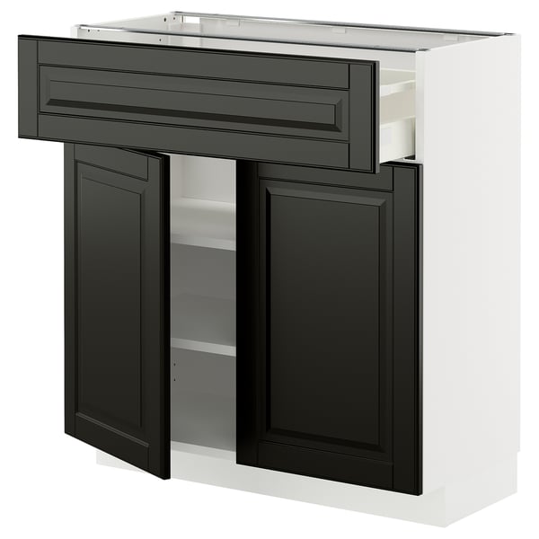 A white METOD kitchen cabinet with black bodbyn doors and drawer fronts, featuring a sleek modern design with bevelled edges.