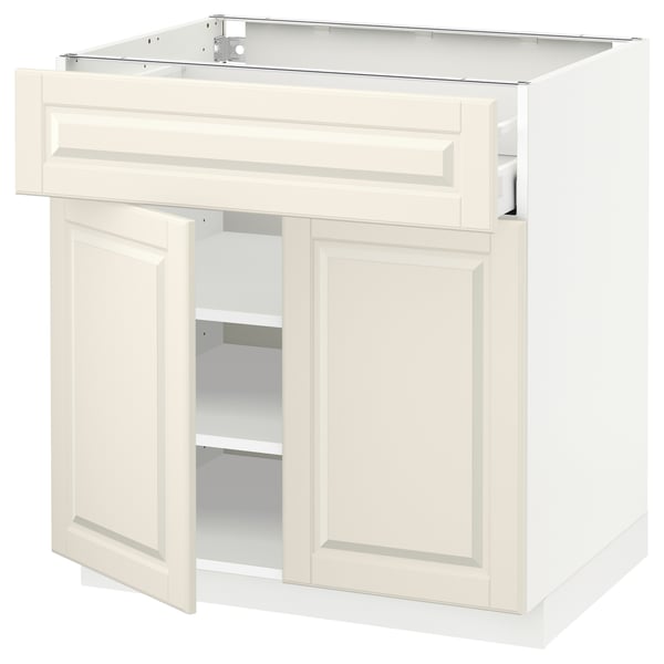 Off-white METOD kitchen cabinet with bevelled doors and drawers, featuring a sturdy frame and soft-closing drawers.