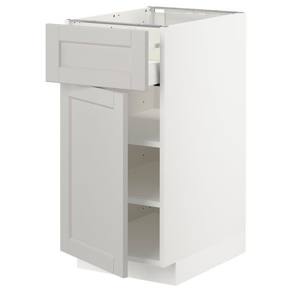 METOD kitchen cabinet in light grey with bevelled edges, adjustable shelves, and a smooth-closing drawer.