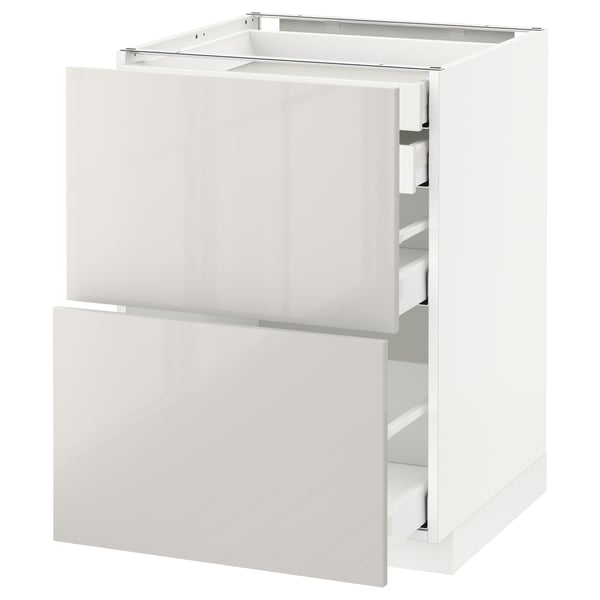 A white METOD kitchen cabinet with a glossy finish. It has two pull-out drawers with sleek, grey handles. The cabinet is modern and rectangular.