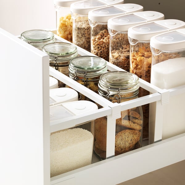 New kitchen drawer organiser holds jars and containers for snacks, ensuring kitchen organisation and easy access.