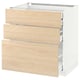 A white METOD kitchen cabinet with three light ash wood drawers, featuring sleek and modern design.