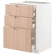 Modern kitchen unit, white base, light wood drawers. Three drawers, sleek handles, clean design.