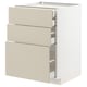 White METOD kitchen unit with beige havstorp drawers, sleek and modern design.