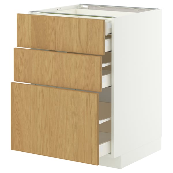 White & oak METOD kitchen cabinet with 3 partially open drawers.