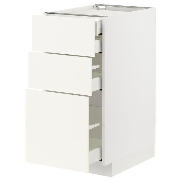 White ikea METOD kitchen cabinet with 3 open drawers, modern design.