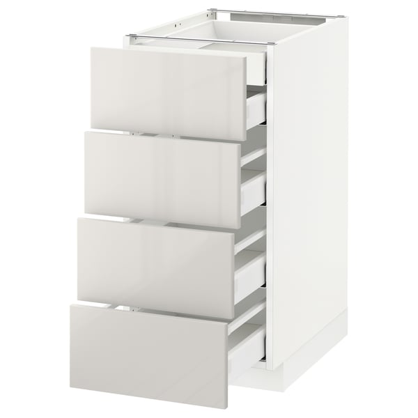 This image shows a white ikea METOD kitchen cabinet with four drawers. The cabinet has a modern design with high-gloss finish and sleek, clean lines.