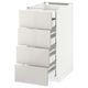 This image shows a white ikea METOD kitchen cabinet with four drawers. The cabinet has a modern design with high-gloss finish and sleek, clean lines.