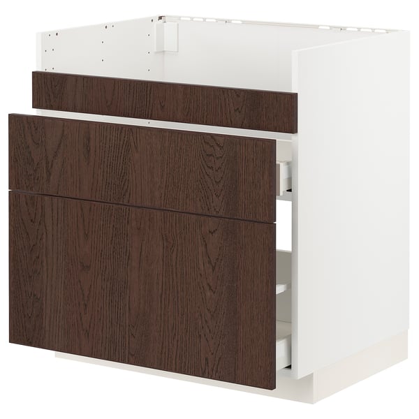 Modern kitchen cabinet in white & dark brown wood, three drawers, sleek design.