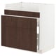 Modern kitchen cabinet in white & dark brown wood, three drawers, sleek design.