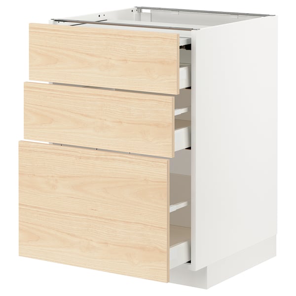 Modern kitchen cabinet with light ash wood drawers on white base, three open drawers.