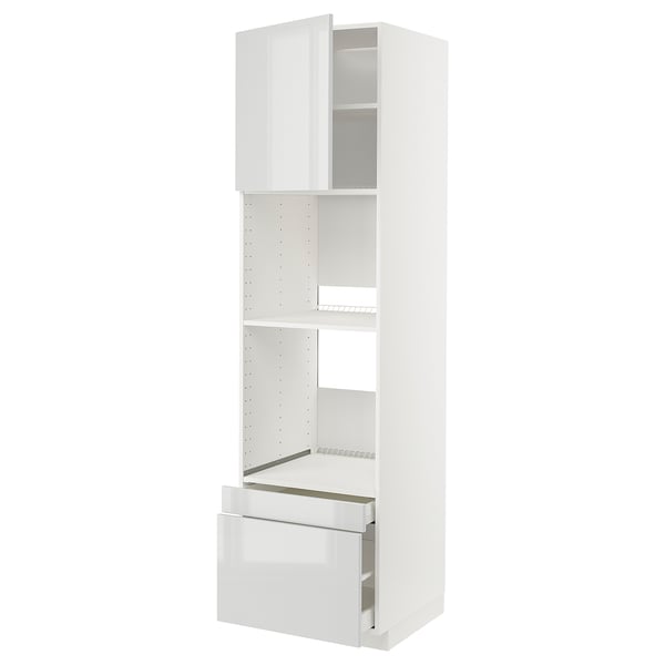 A white METOD kitchen cabinet with a glossy finish, featuring a drawer and adjustable shelves.