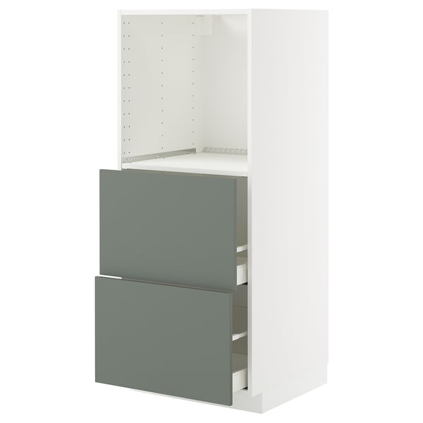A white METOD kitchen unit with green-gray drawers and an open storage section. The unit smooth, modern design and adjustable shelves.
