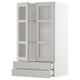 White METOD kitchen unit with glass doors, adjustable shelves, and drawers.
