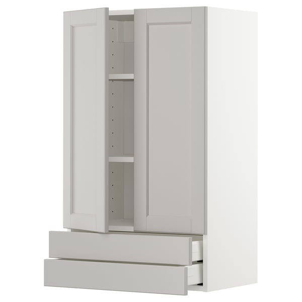 A white kitchen cabinet with classic design, open door showing adjustable shelf, and two soft-close drawers.