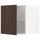 An open METOD kitchen cabinet with dark brown sinarp wood doors, white interior, and adjustable shelves.