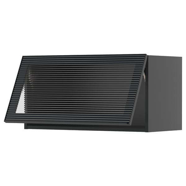 Modern black kitchen cabinet with sleek glass door and vertical reeded design.