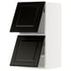 Black modern kitchen cabinets with beveled edges.