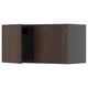 Dark brown wooden cabinet with one open door, part of ikeas METOD kitchen system.