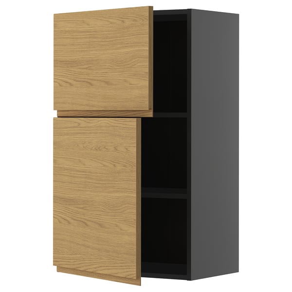 Modern kitchen cabinet with oak doors and black body, square shape.