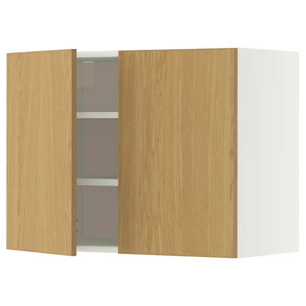 A wooden kitchen cabinet with light oak doors and multiple shelves.