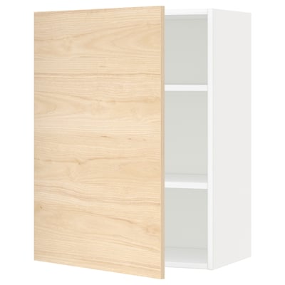 A white ikea METOD kitchen wall cabinet with a light ash wooden door, featuring a minimalist design and adjustable shelf inside.