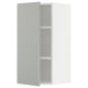 Open white METOD kitchen cabinet with light grey shelves.