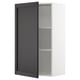 Modern wall cabinet in white with dark wood door open, revealing gray shelves.