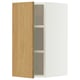 A METOD wall cabinet with a light oak door and white frame. It has three adjustable shelves and is mounted on the wall.