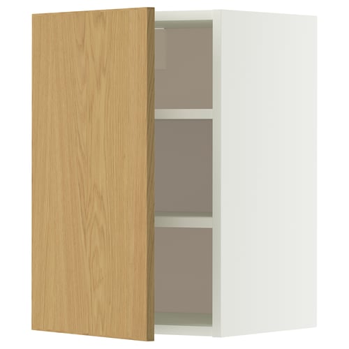 An open white METOD wall cabinet with a light oak door, featuring two shelves inside.