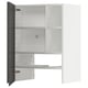 A white METOD kitchen cabinet with grey doors, featuring an adjustable shelf and snap-on hinges.
