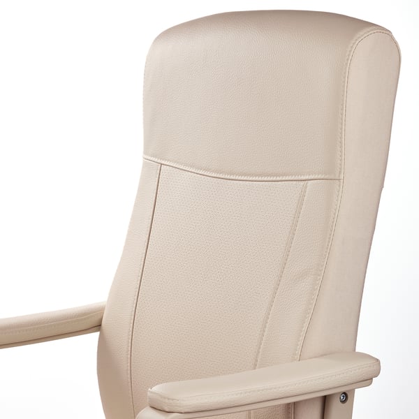 Close-up of a high-quality office chairs cushioned headrest and armrest, covered in beige fabric with delicate stitching.