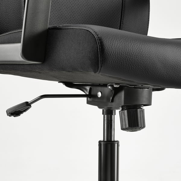 Black office chair with adjustable height and tilt tension, visible gas lift and armrests.