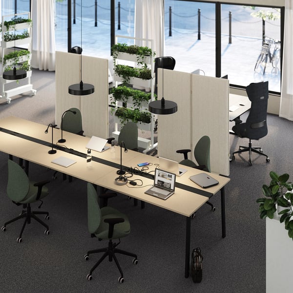 MITTZON beige conference table with workstations, green chairs, lamps. Collaborative or solo.
