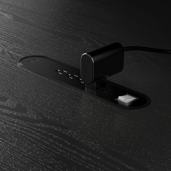 Usb hub on wooden table for charging and data transfer.