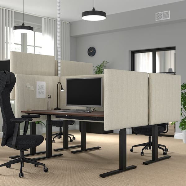 Modern office with MITTZON sit/stand desks and ergonomic chairs, enhancing focus and comfort.